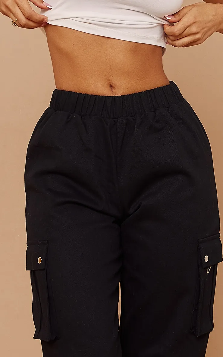 Petite Pantalon cargo noir avec détail poches