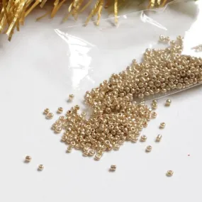 Sachet de rocailles doré